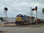 CSX 8636 passing the station sign WB on the BNSF